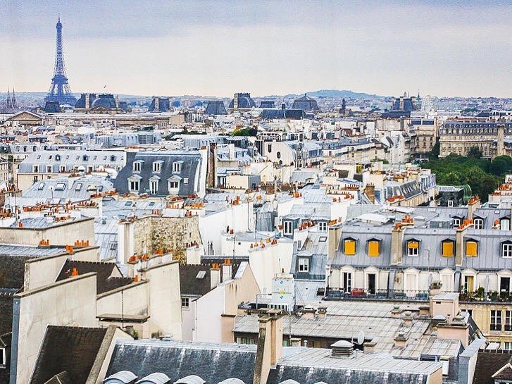 Paris rooftops with the Eiffel Tower in the distance